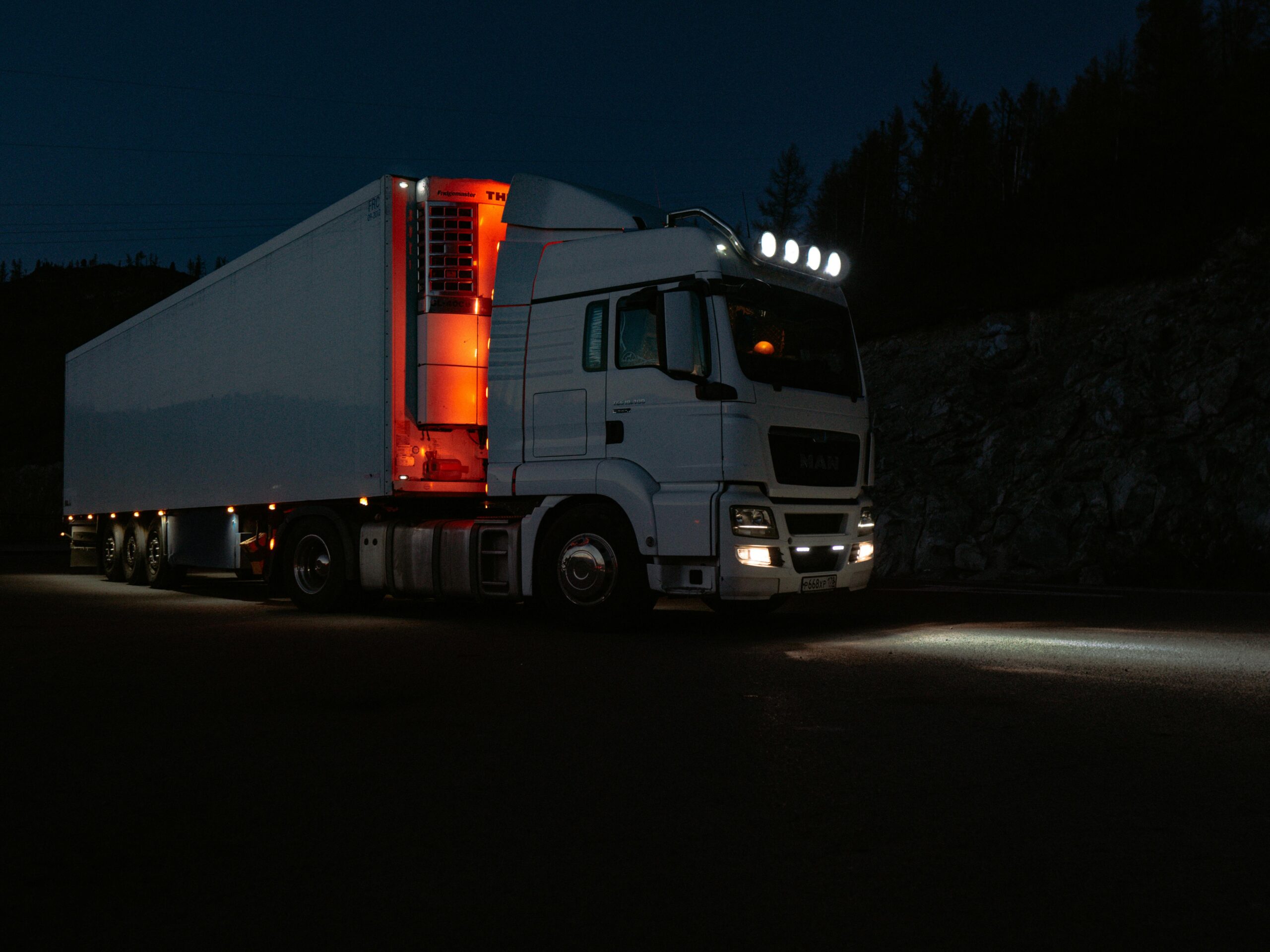 Highway at dusk with trucks