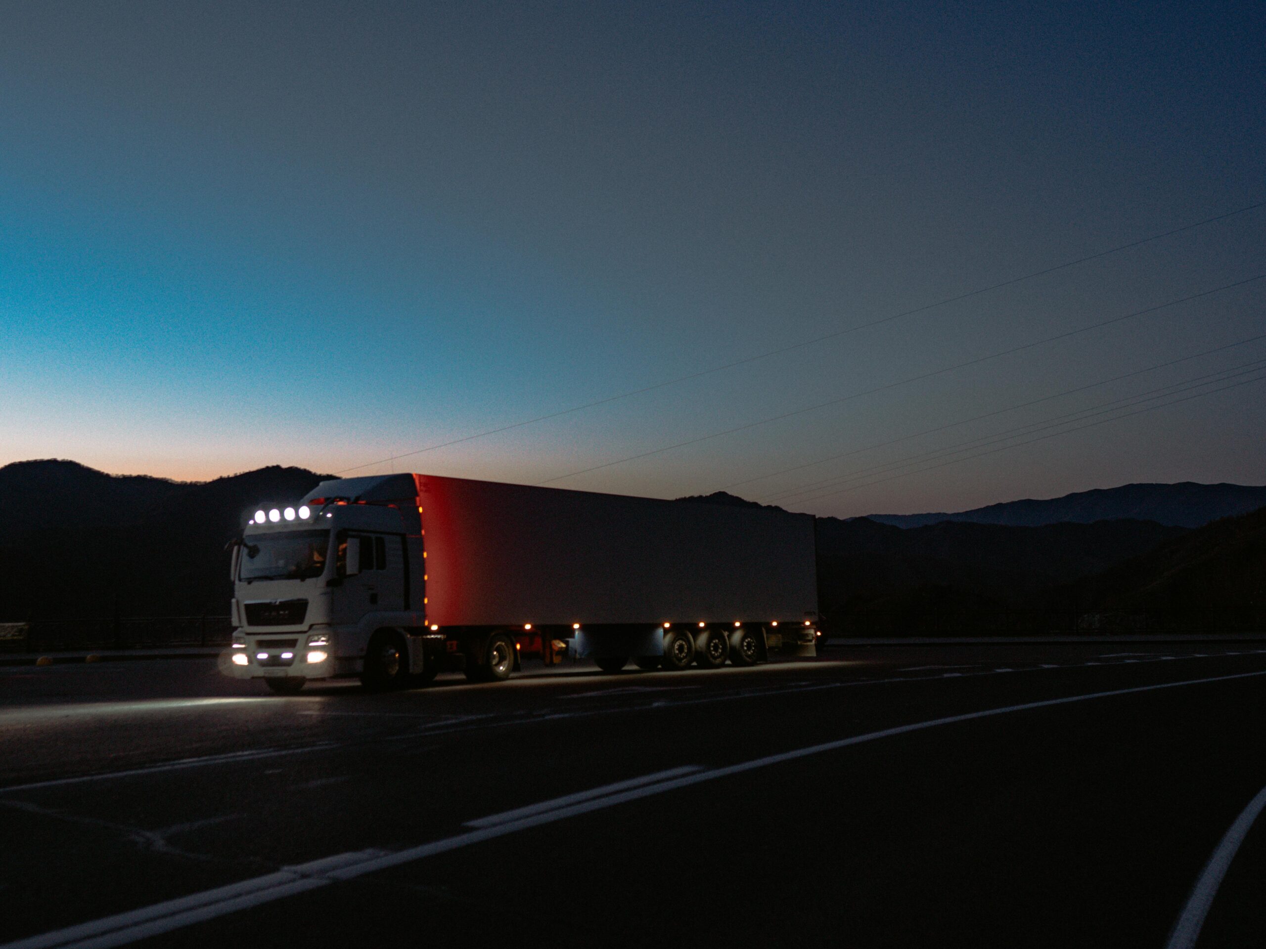 Highway with trucks at night